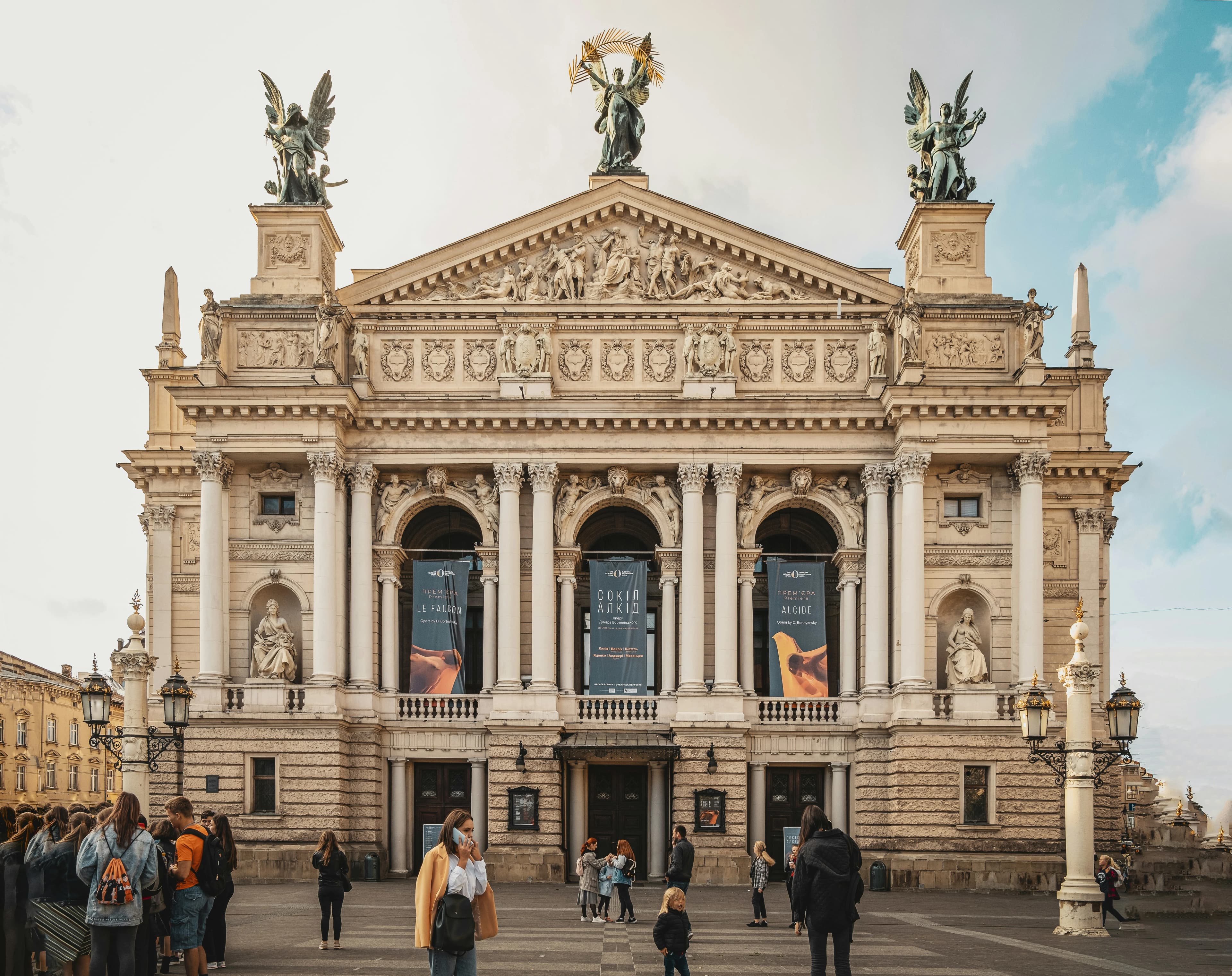 The Lviv Theatre of Opera and Ballet, a grand and ornate building with sculptures on its roof.