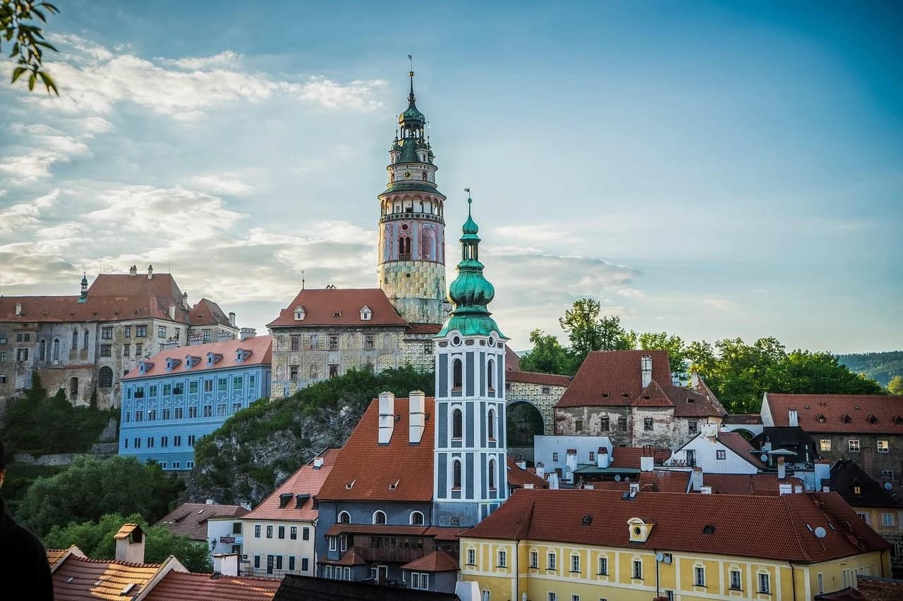The iconic painted tower of Český Krumlov Castle rises majestically above the historic rooftops of the town.