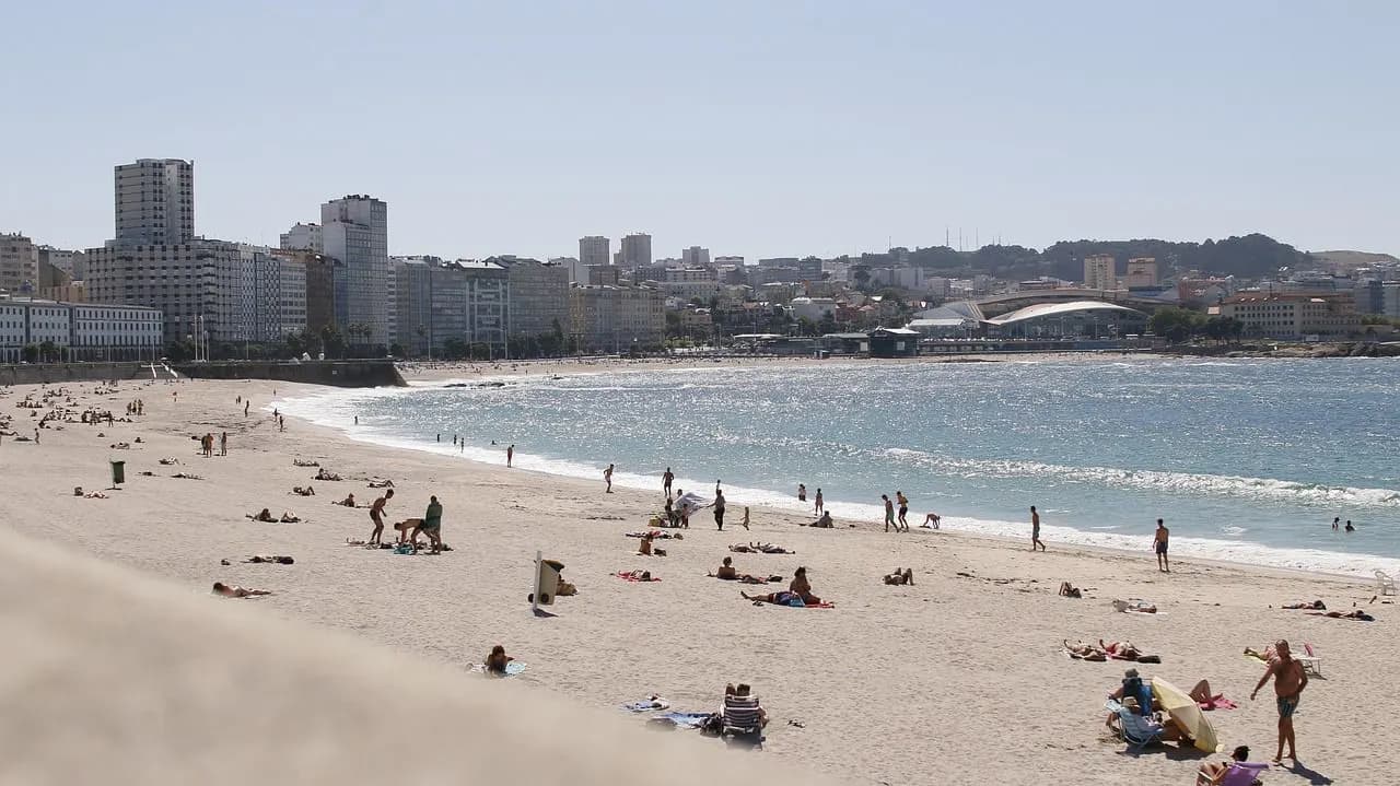 A panoramic view of A Coruña’s coastline with the ancient Tower of Hercules lighthouse rising above the rugged Atlantic shore.