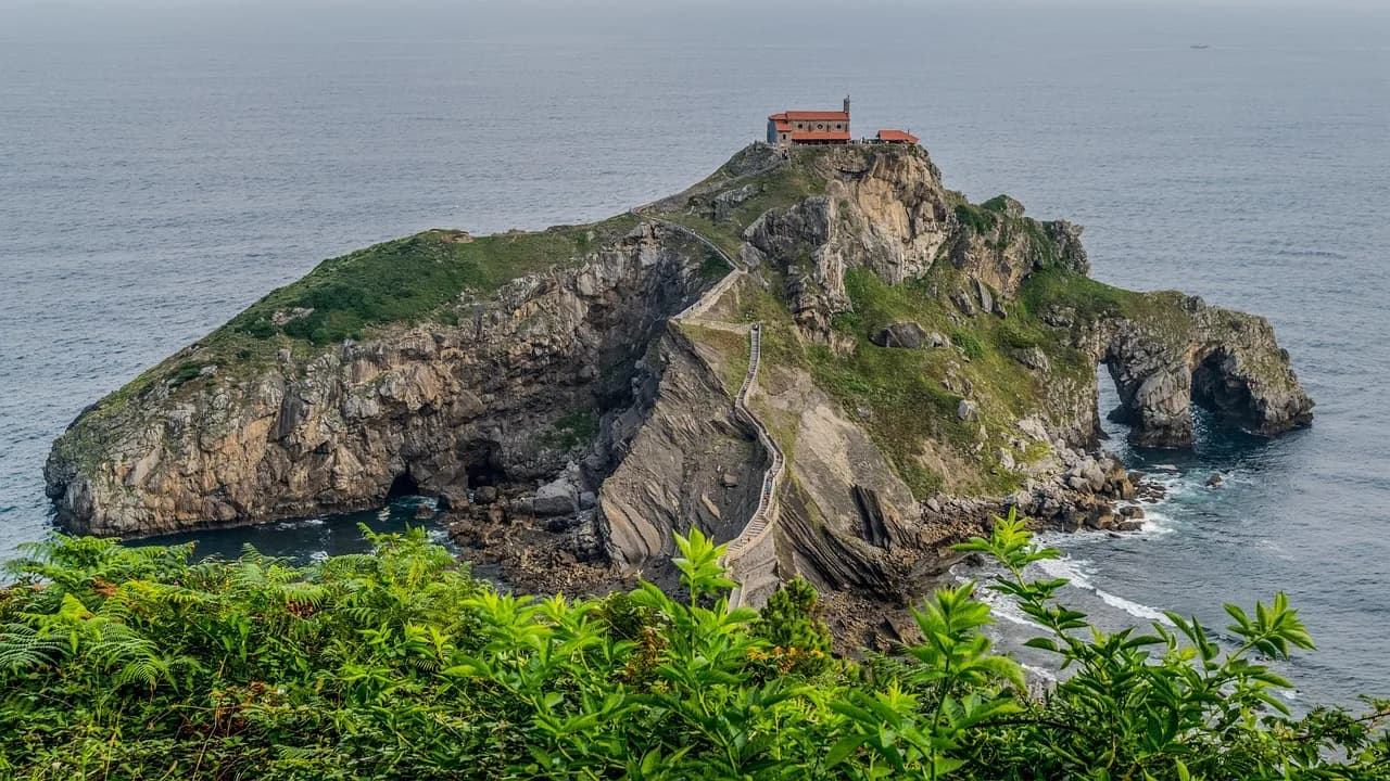 The San Juan de Gaztelugatxe, a dramatic stone hermitage and bridge, sits on a rocky island off the coast of the Basque Country.