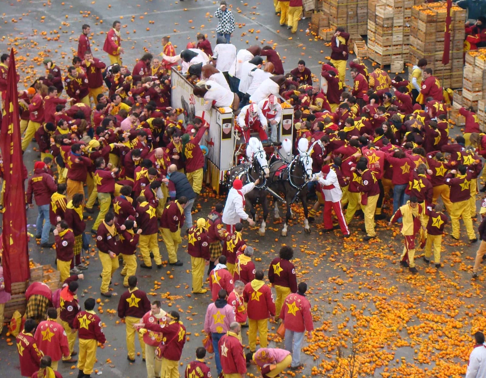 The annual Battle of the Oranges, a unique and chaotic festival, fills the city square with participants throwing oranges at each other.