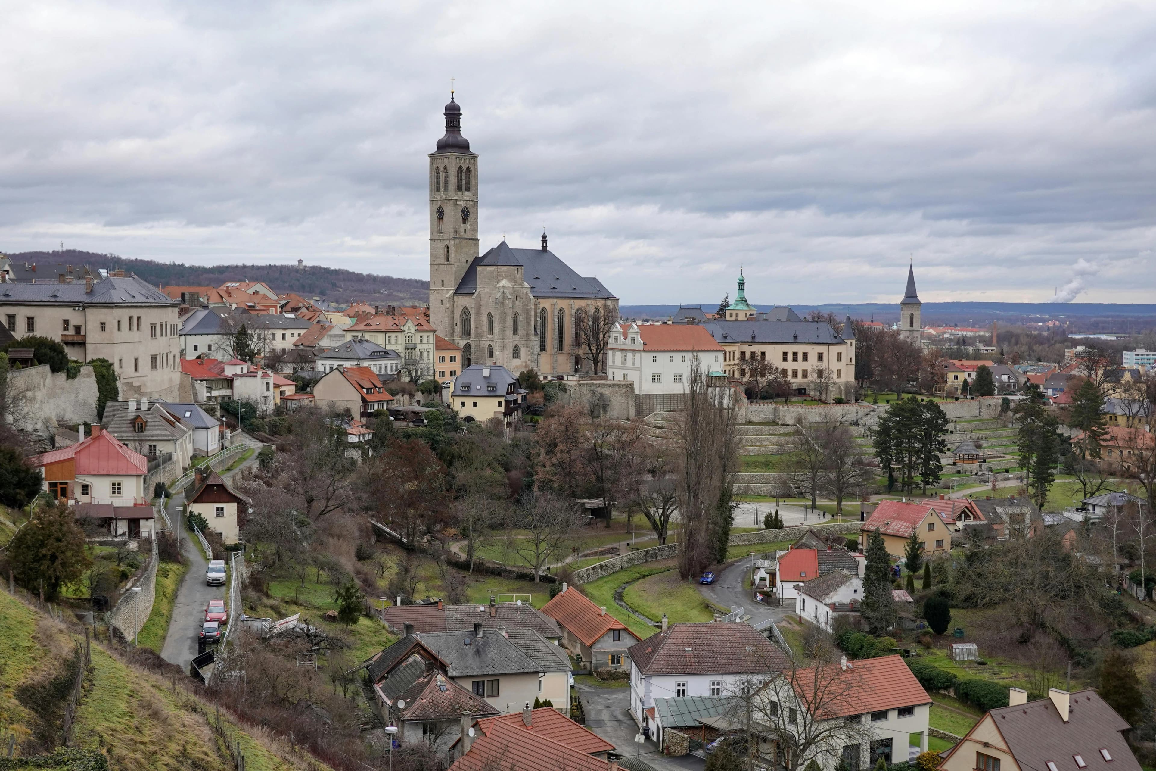 A panoramic view of Kutná Hora shows the historic St. James's Church rising above the traditional red rooftops.