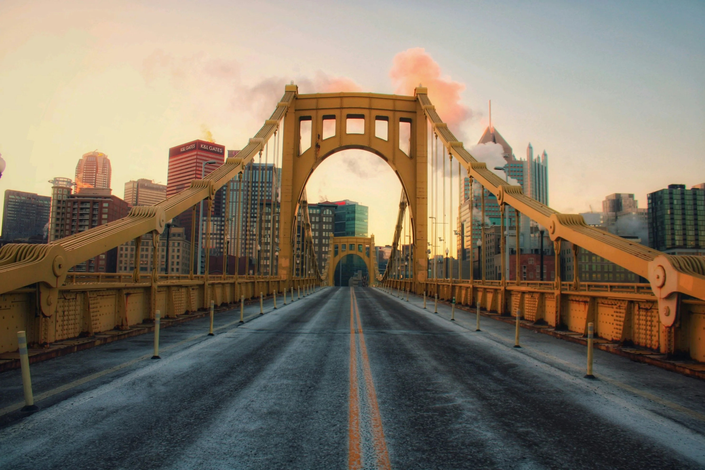 A stunning view of the Pittsburgh skyline at night, with the city lights twinkling and the bridges spanning the river.