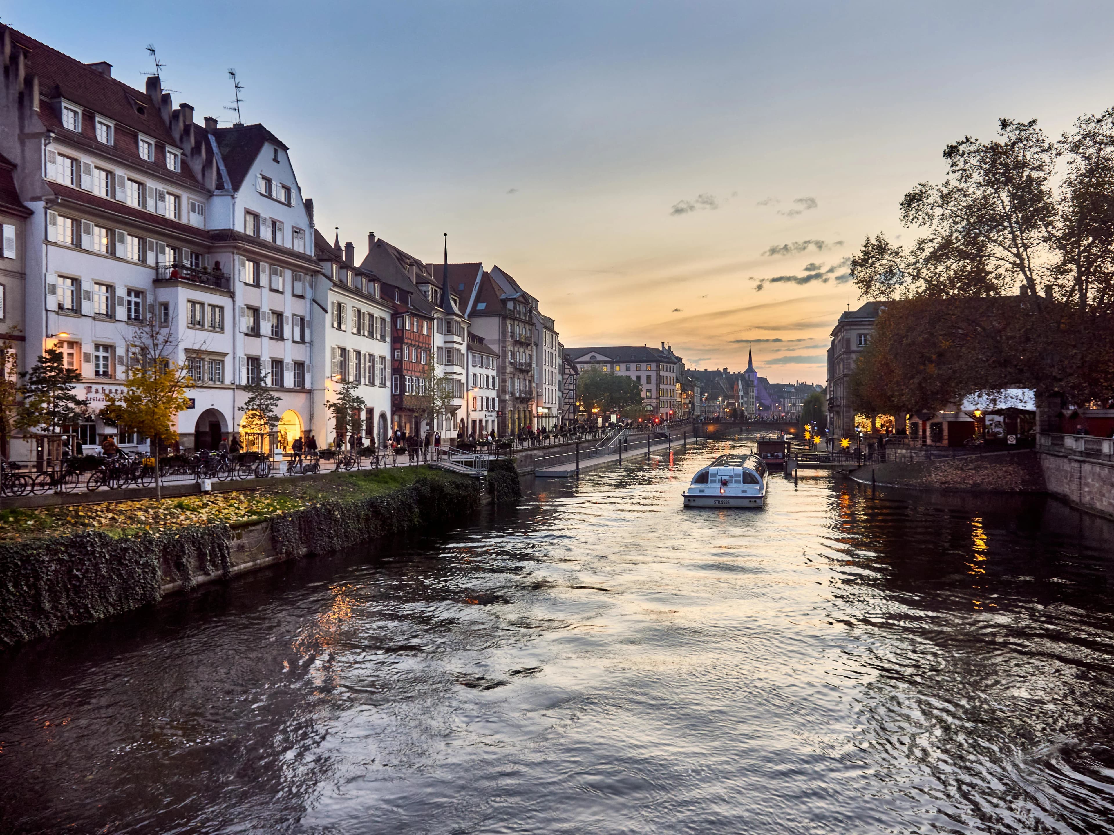 The majestic Strasbourg Cathedral, a gothic masterpiece with a soaring steeple, stands tall above the city's rooftops.