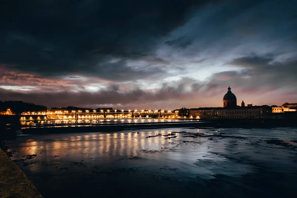 The historic Capitole de Toulouse, a magnificent neoclassical building, is a beautiful backdrop to a bustling public square.