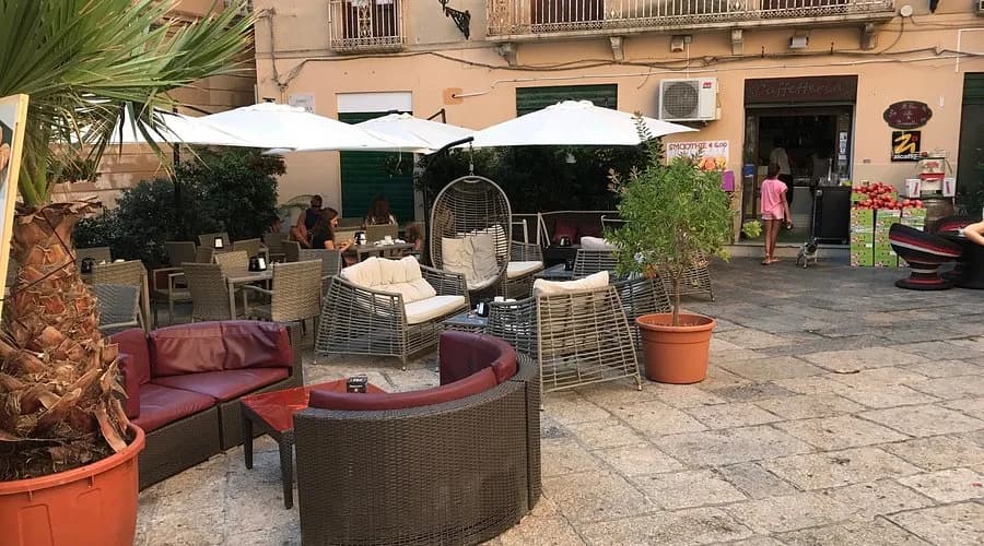 The majestic Walls of Trapani, a series of fortified stone walls, stand on the edge of the sea.